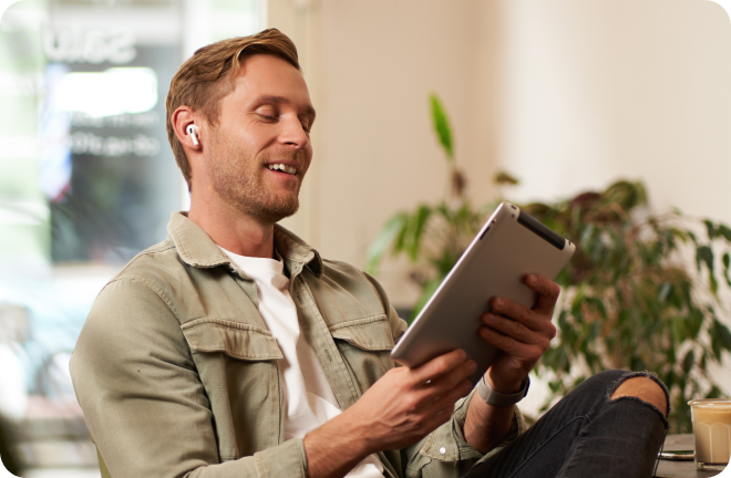 Guy looking at tablet 