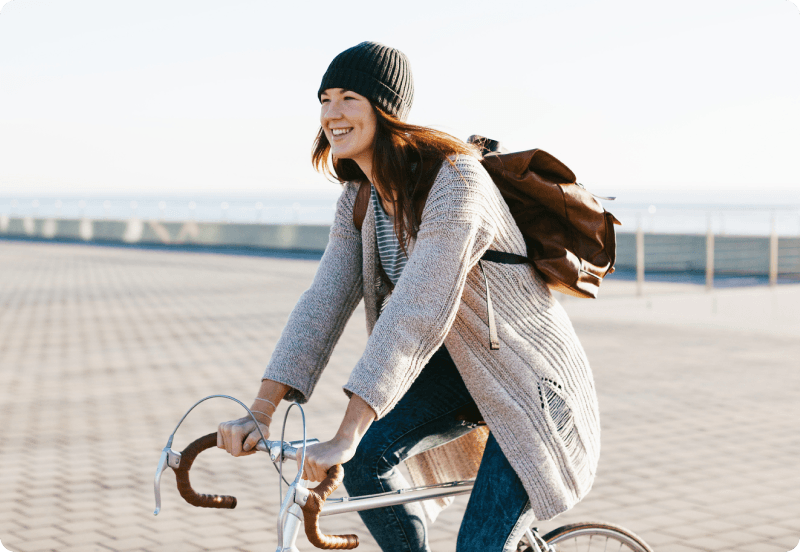 Woman riding her insured bike