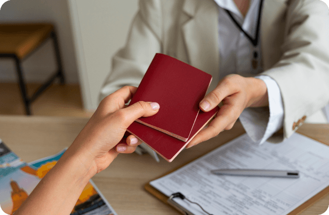 2 hands with 2 passports