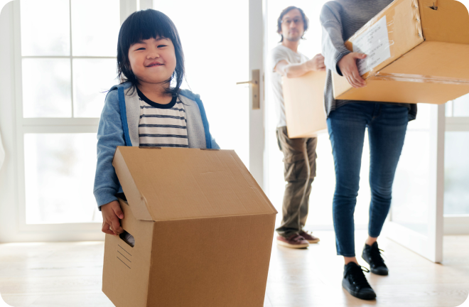 a kid carrying a box