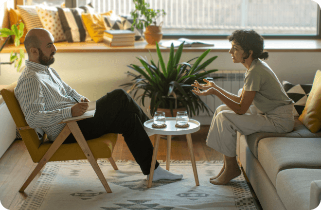 two people discussing sitting