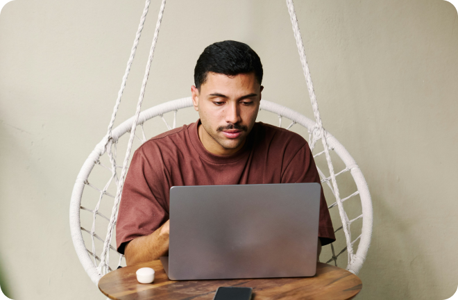 Photo of a men with his computer, remote working 