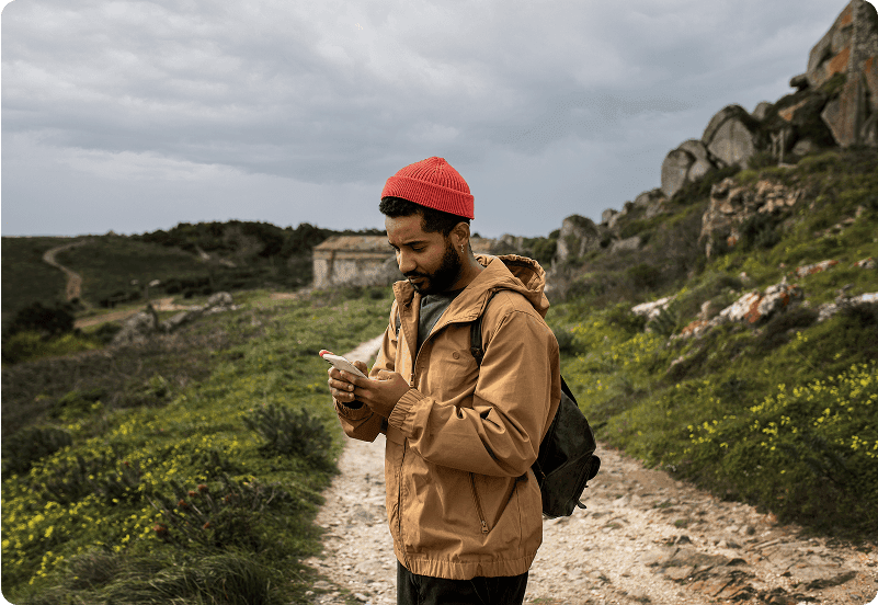 Spanish visa applicant looking at his phone