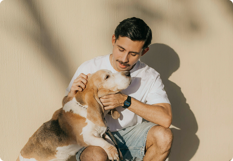 Person cuddling their dog on a walk.