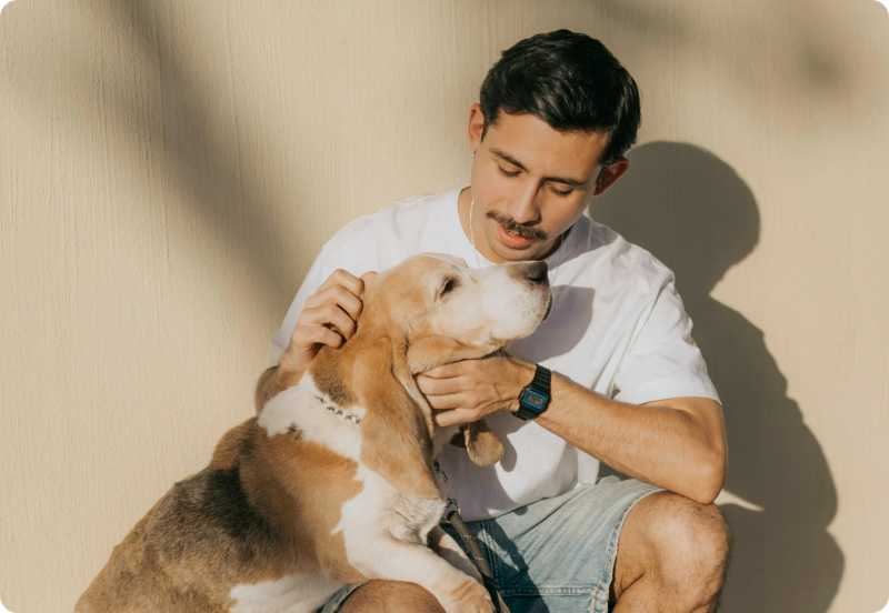 Person cuddling their dog.
