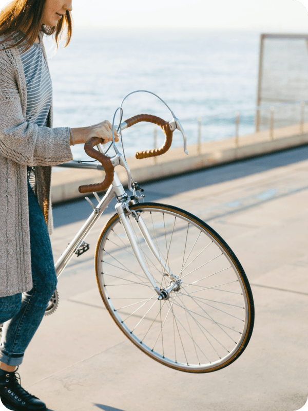 Girl holding bike