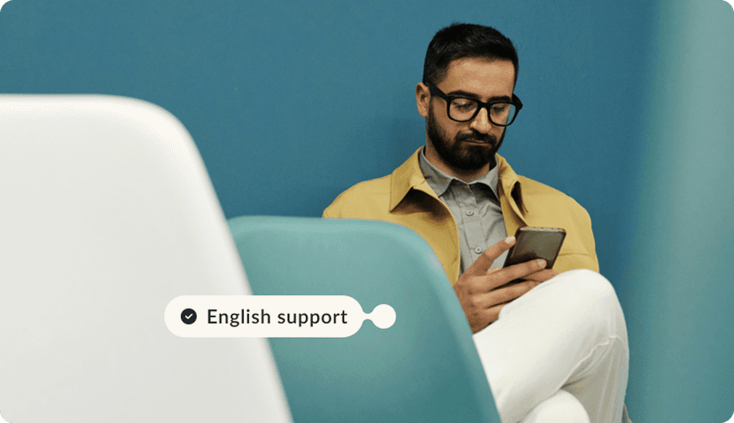 Men with a phone with english support tag