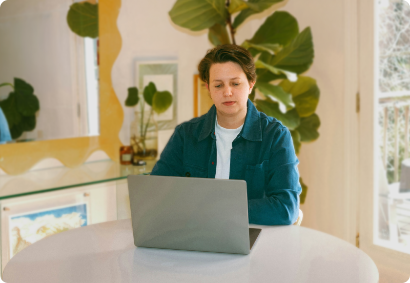 Person working on a laptop at home.