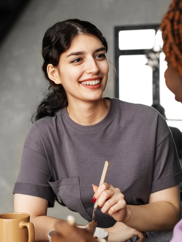 A woman smiling in a conversation