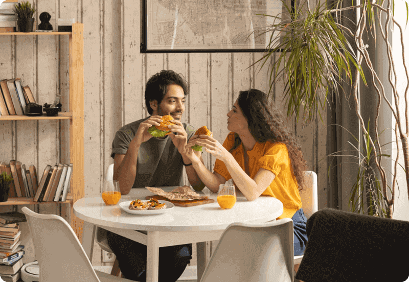 Spanish couple eating in their home