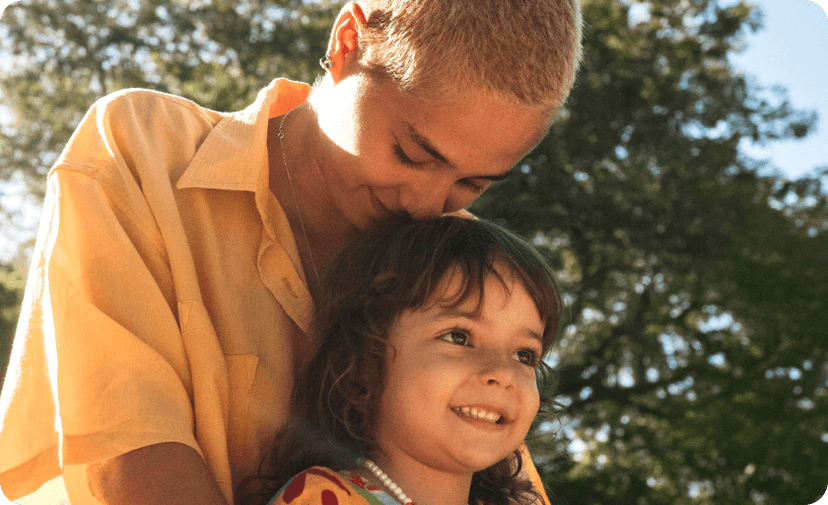 A mother with her child spending a sunny day in a park in Italy.