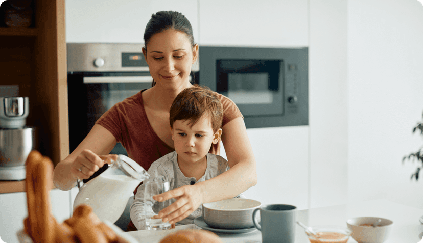 Expat feeding her son