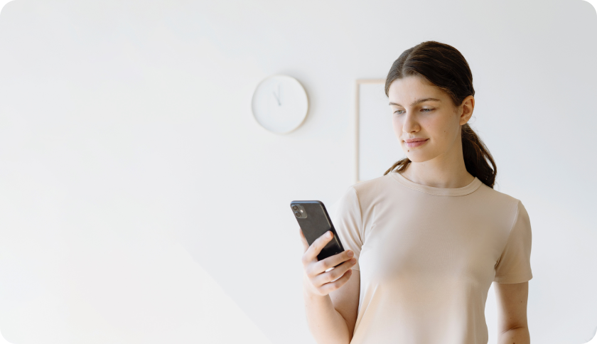 Woman holding her phone