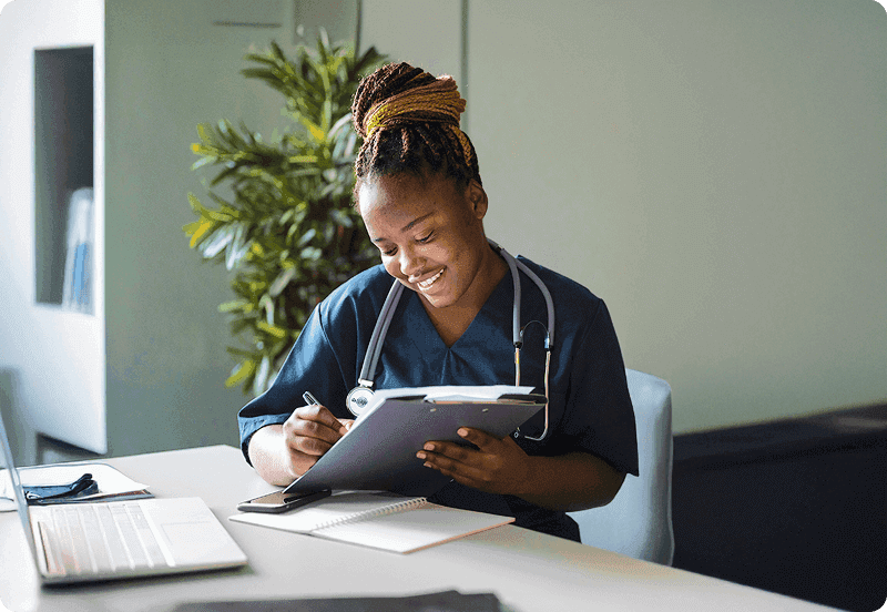 Nurse completing a Belgian public health insurance form at their desk