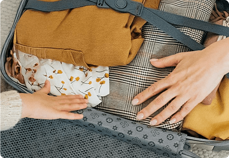 Woman packing her back after getting her family reunion visa