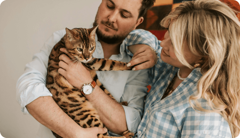 family holding a cat