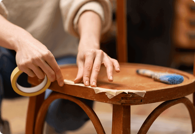 Woman fixing the chair she broke.