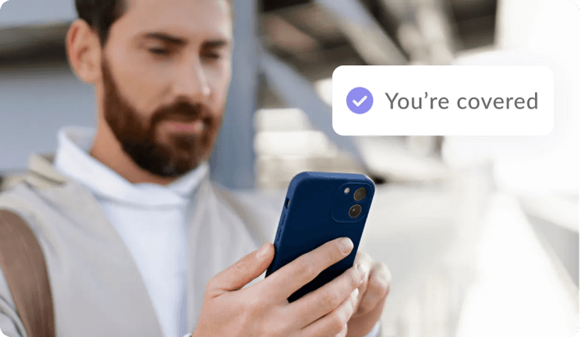 Man signing up for travel insurance on his phone