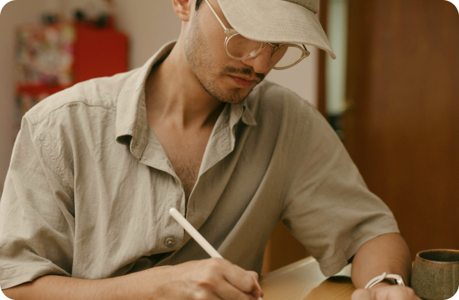 Man writing on his desk
