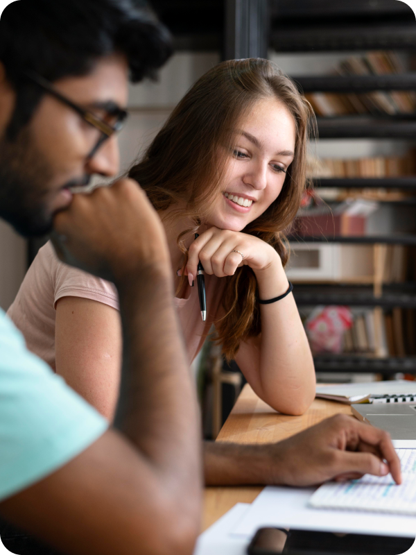 Students working together on a paper.