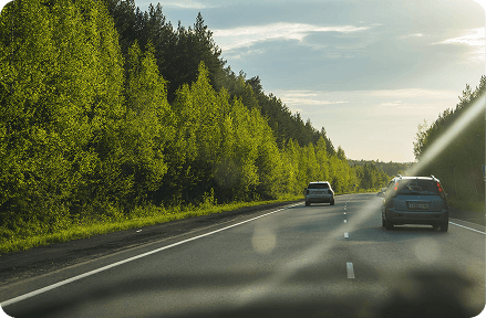 Cars driving on a road.