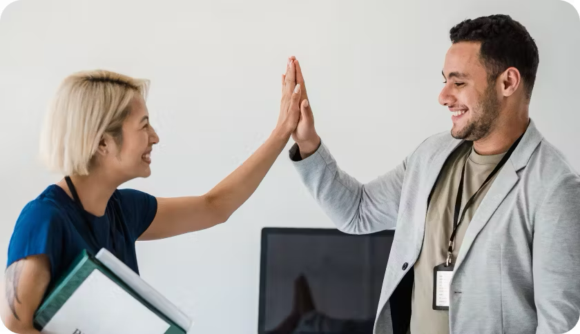 Team mates celebrating their health plan.