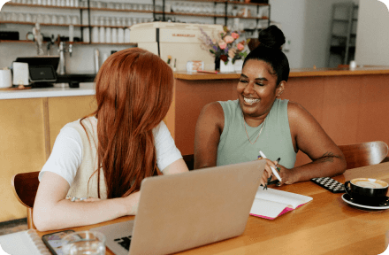 Two coworkers working on a project together in Bulgaria.
