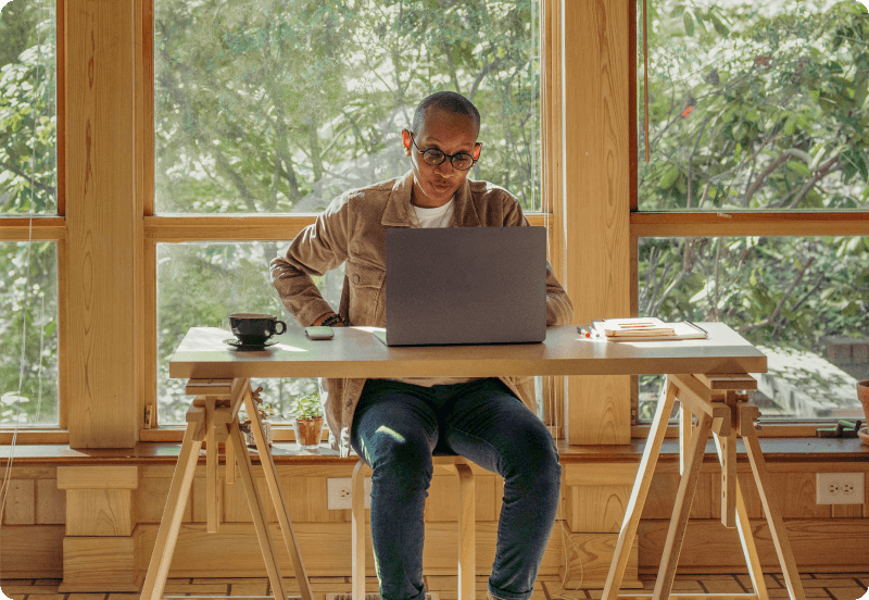 Person working on a laptop at home.