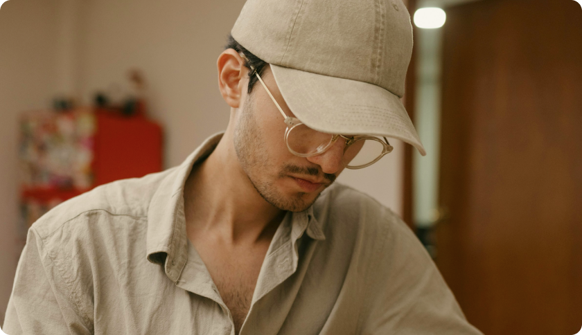 A man sitting and working on his laptop.