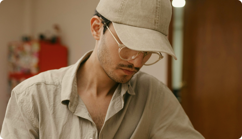 A man sitting and working on his laptop.