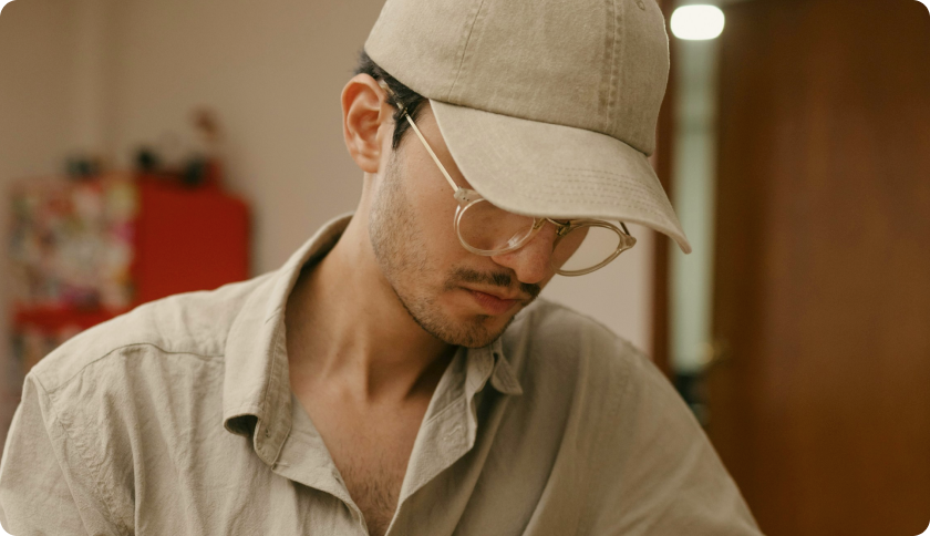 A man sitting and working on his laptop.