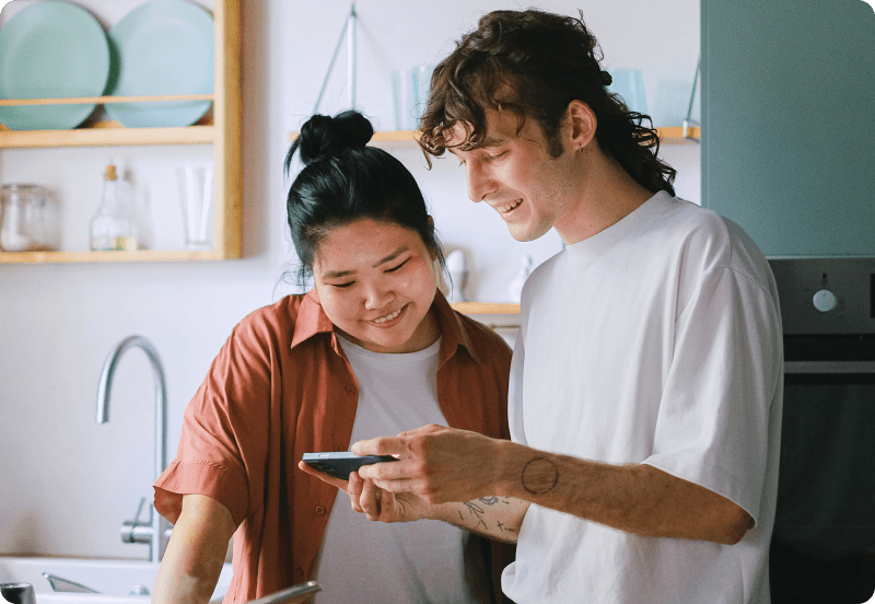 Two expats comparing Japanese health insurance options