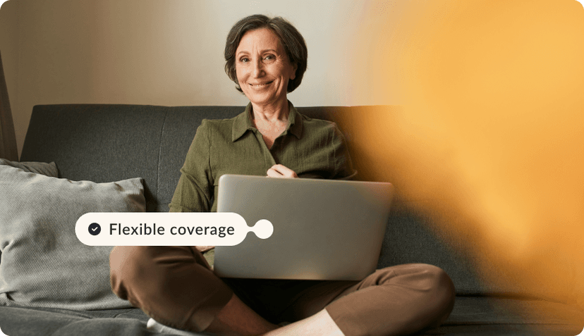 A woman who's an expat in Portugal adjusting her policy on a laptop.