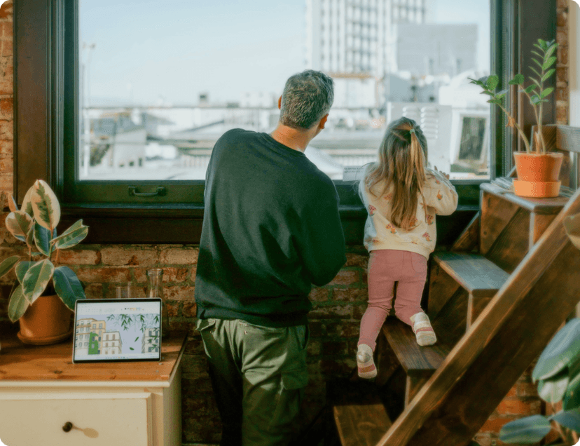 A father and his daughter looking through the window in their cozy apartment in Portugal.