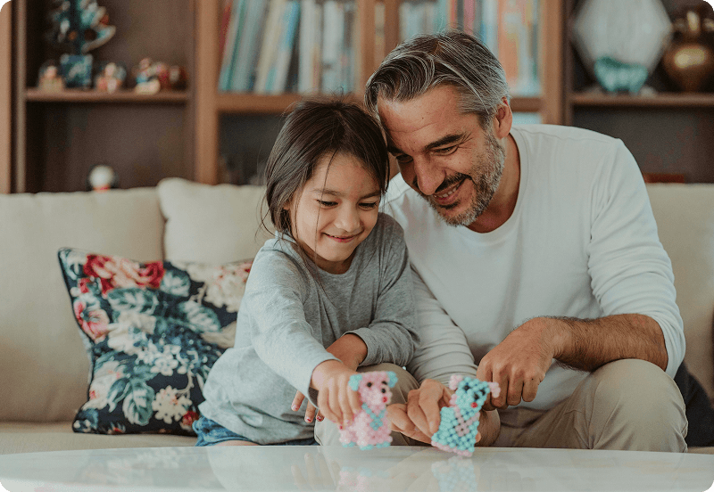 Father and a daughter playing together.