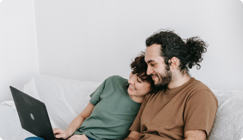 Couple looking at laptop