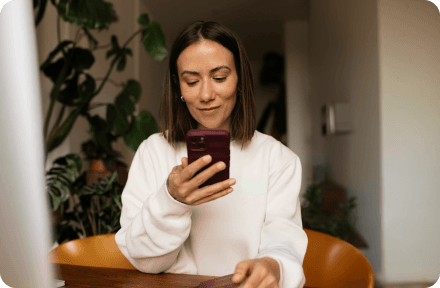 A woman looking at her phone